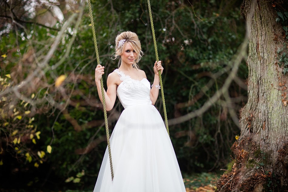Playful and demure bride on a swing, expressing her little girl qualities