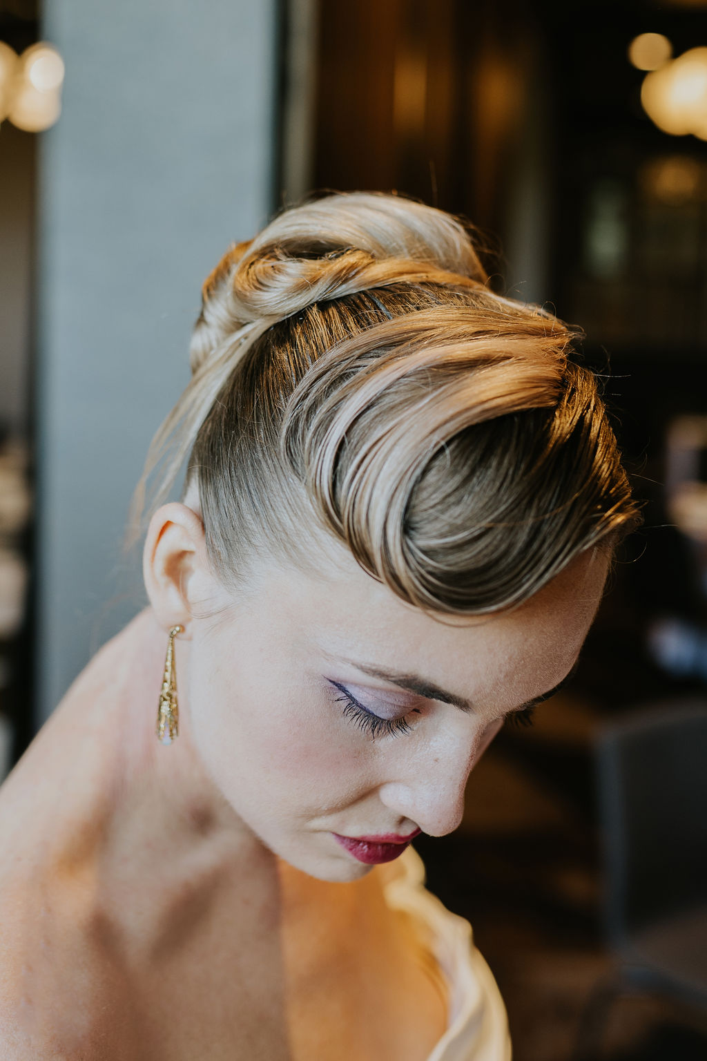 Close-up of bridal eye makeup with sharp winged eyeliner, polished brows, and natural lashes