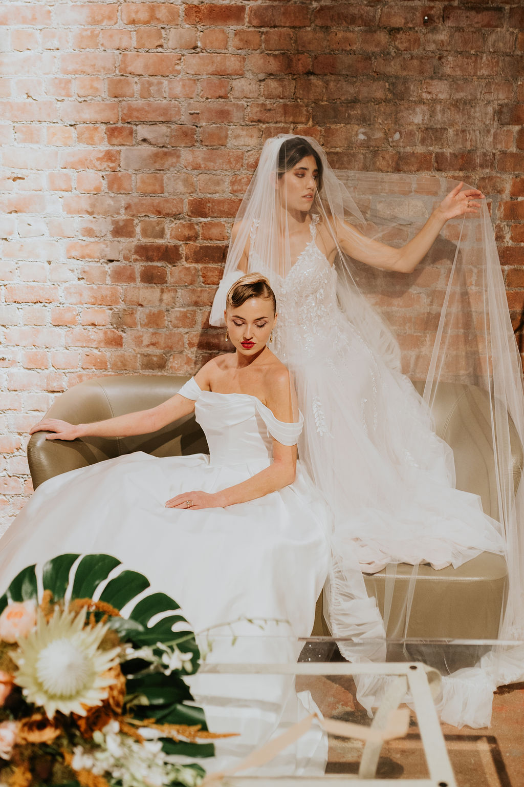 Model in timeless Madi Lane bridal gown with mocha colour palette, styled with bold lipstick